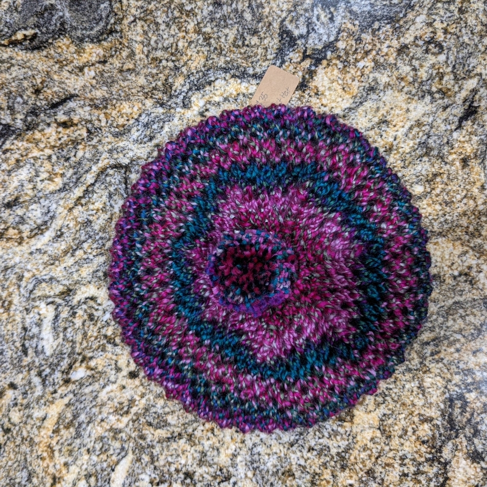 Purple knitted baret hat